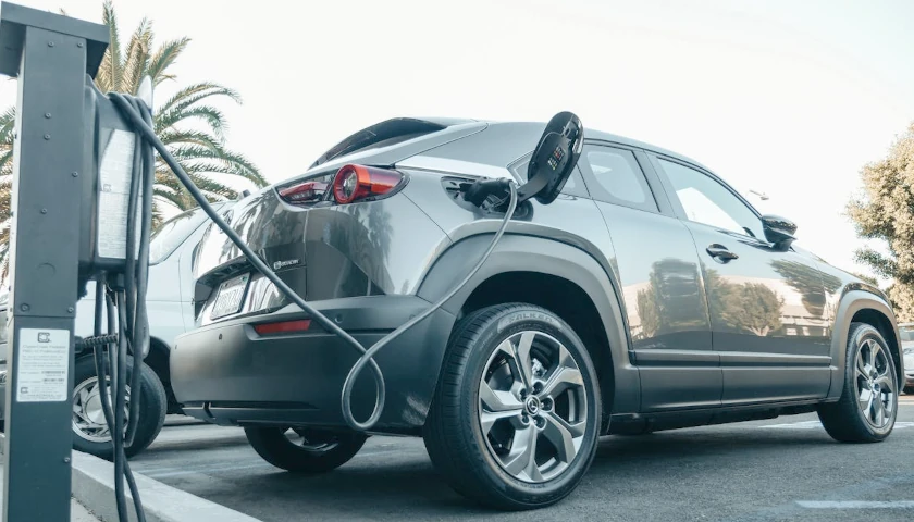 Electric Vehicle plugged into charging station