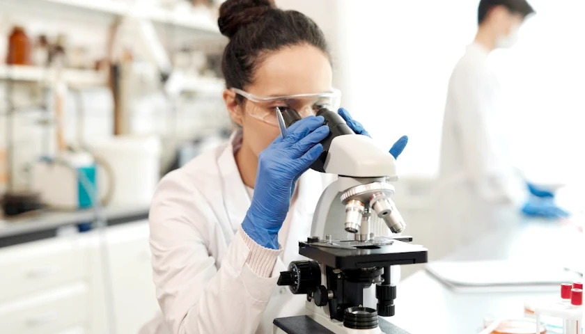 Woman using a microscope