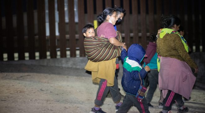 A group of migrants sought out law enforcement officials so they could turn themselves in and try to apply for asylum near the Hidalgo Point of Entry on August 9, 2021. (Kaylee Greenlee – Daily Caller News Foundation)