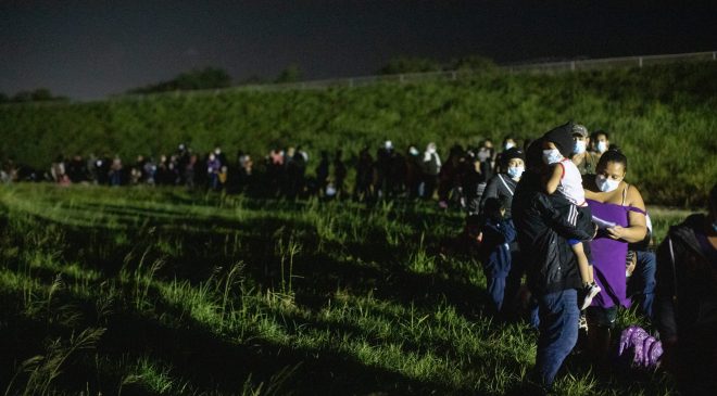 Hundreds of migrants waited in a line to be processed by four Customs and Border Protection agents near the Hidalgo Point of Entry on August 9, 2021. (Kaylee Greenlee – Daily Caller News Foundation)