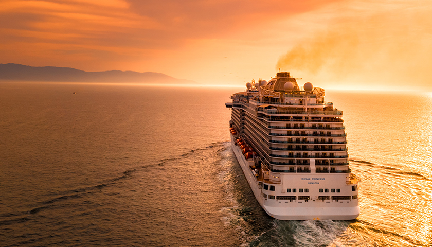 Cruise ship in the ocean during sunset