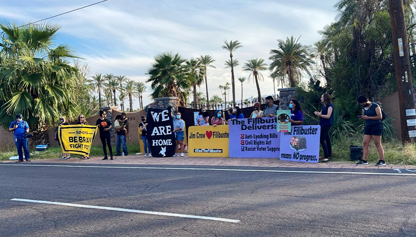 LUCHA Arizona protesting outside during the day about the filibuster