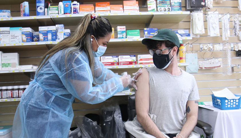 healthcare worker giving vaccination