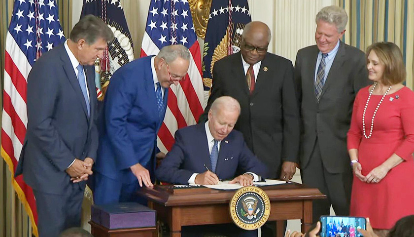 Biden Signs $740 Billion Climate, Tax and Health Care Bill into Law