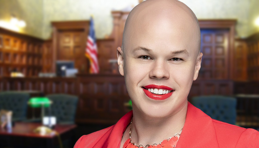 Biden’s Genderfluid Nuclear Waste Official Charged Again with Stealing Someone’s Luggage