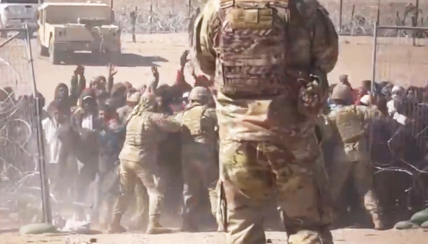 Video Shows Illegal Migrants Overwhelming Texas National Guard, Storming Border Wall