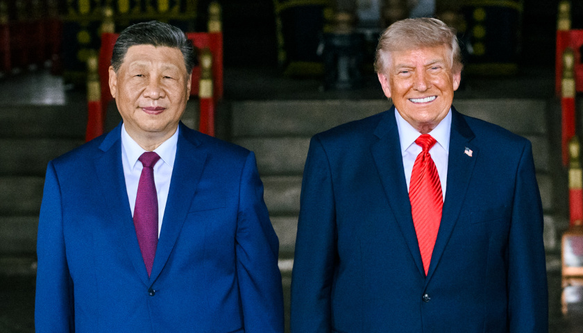 Commentary: Trump’s Economic Fist Behind The Lovefest In Beijing